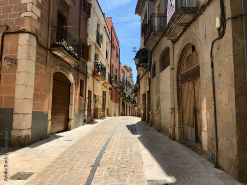 Montblanc  Spain  June 2019 - A large brick building with a clock on the side of the street