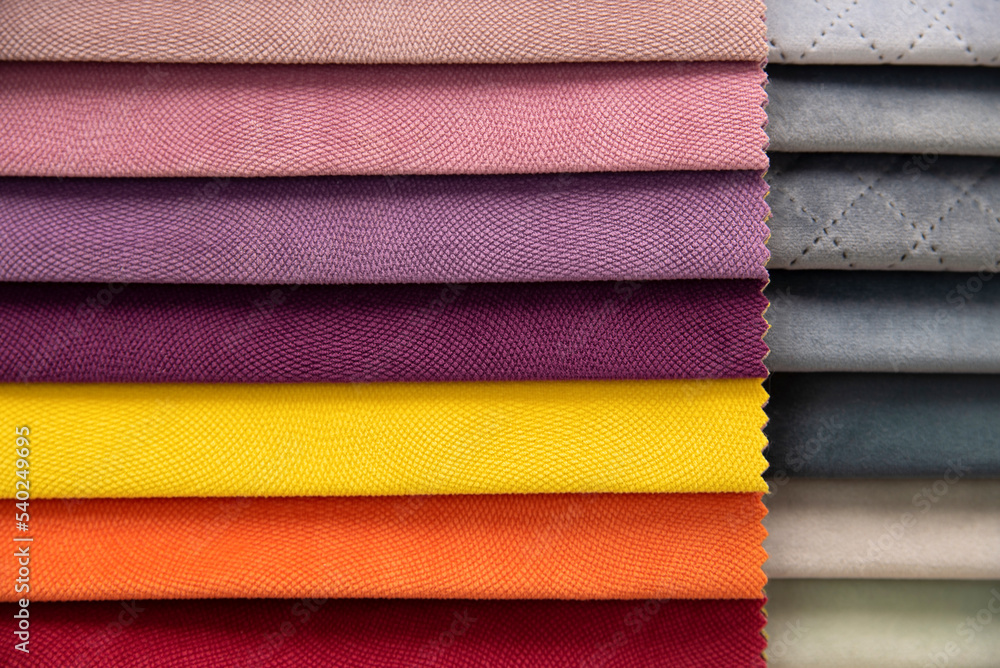 A comparison of upholstered furniture fabrics with warm colors and cool