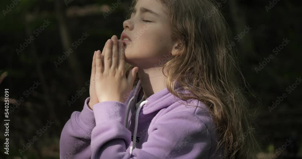 Religion. Child Girl Folded Lifestyle Her Hands in Prayer Pray to God on Outdoor. Worried Teenager Girl Looking for Hope and Faith Praying to God. Religious Child With Hope in His Heart Prays to God. Religion. Child Girl Folded Lifestyle Her Hands in Prayer Pray to God on Outdoor. Worried Teenager Girl Looking for Hope and Faith Praying to God. Religious Child With Hope in His Heart Prays to God.