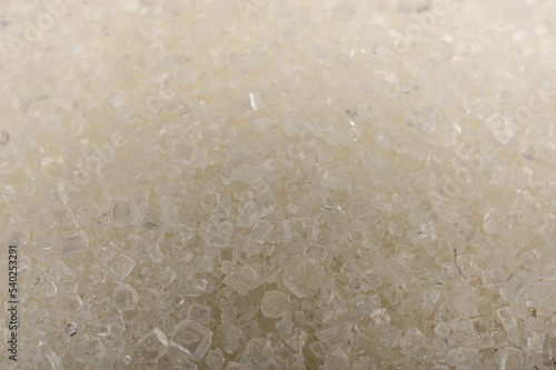 kryształy białego cukru jako tło w dużym zbliżeniu w makrofotografii