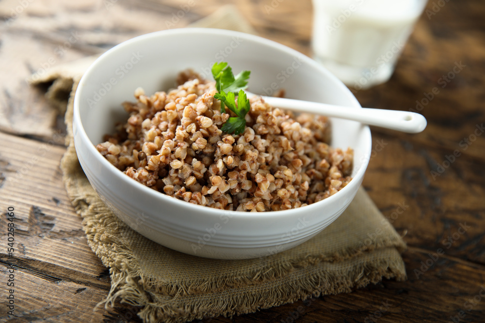 Traditional homemade buckwheat porridge in a white bowl Traditional homemade buckwheat porridge in a white bowl