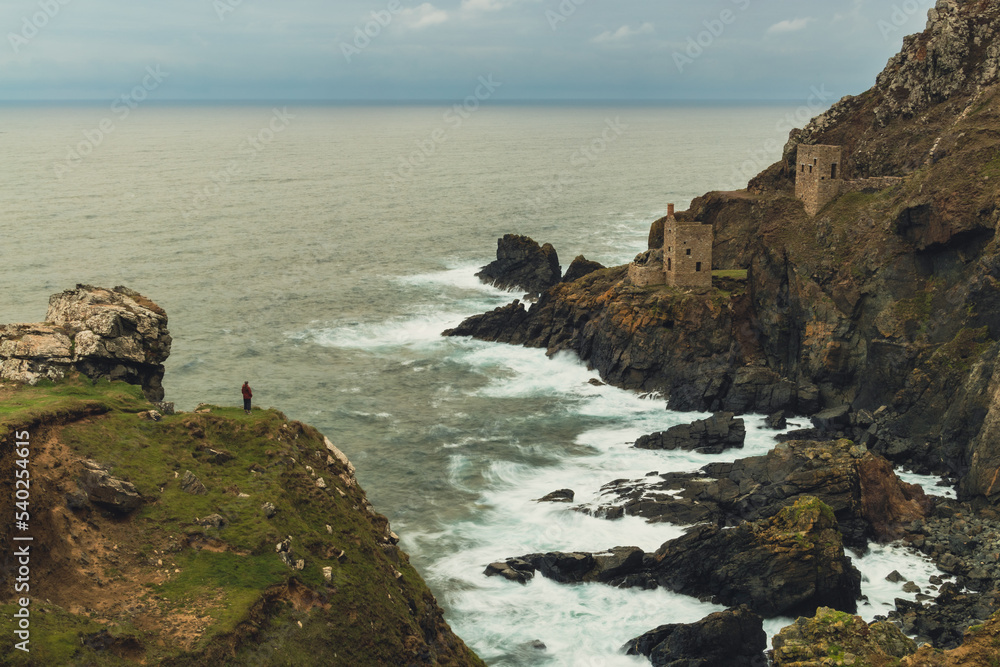 person standing on cliff edge at botallack tin mine