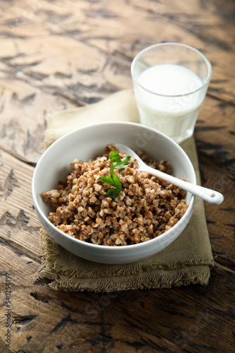 Traditional homemade buckwheat porridge in a white bowl