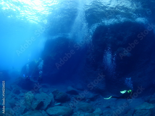 underwater scenery with strange rocks scuba divers around ocean scenery landscape topography underwater mediterranean