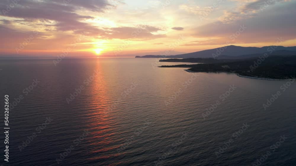 Aerial view of a sunset over a beautiful sea with waves. Tropic nobody nature seascape. Thassos island in Greece. Golden hour Aerial view of a sunset over a beautiful sea with waves. Tropic nobody nature seascape. Thassos island in Greece. Golden hour