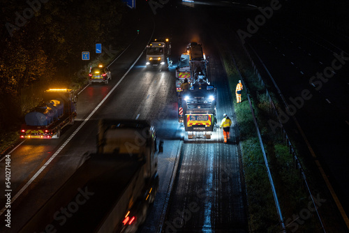 High angle view of road resurfacing work at night photo