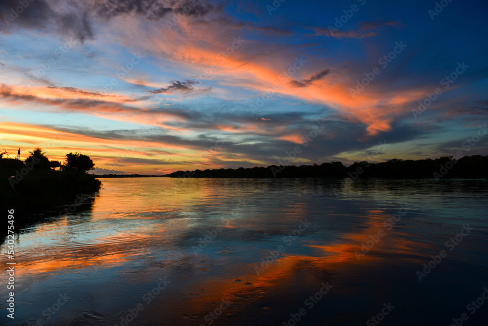 Twilight on the Guaporé - Itenez river from the remote village of Versalles, Beni Department, Bolivia, on the border with Rondonia state, Brazil Twilight on the Guaporé - Itenez river from the remote village of Versalles, Beni Department, Bolivia, on the border with Rondonia state, Brazil