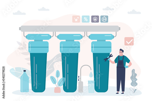 Employee installs water purification system in client kitchen. Specialist with tools engaged in maintenance of liquid filters