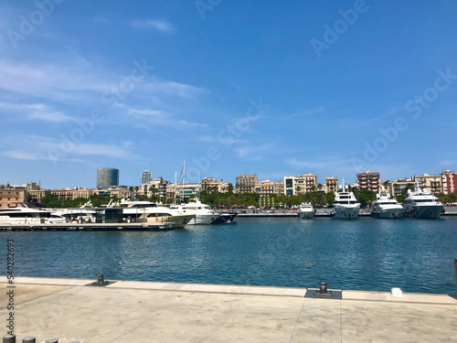 Barcelona, Spain, June 2019 - A body of water with a city in the background