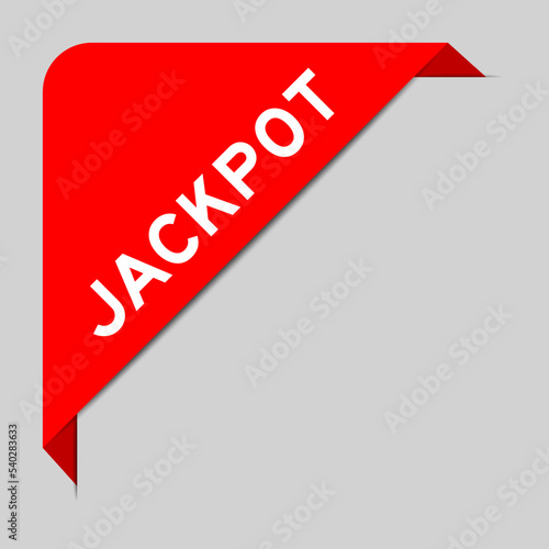 Red color of corner label banner with word jackpot on gray background