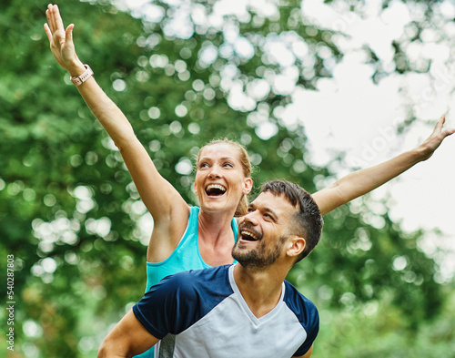 fitness woman man sport exercise together young love active couple piggyback fun healthy fit sport lifestyle running jogging healthy fit workout © Lumos sp