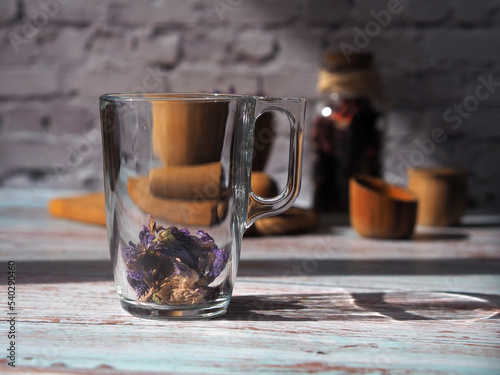 Glass mug with dry flower tea