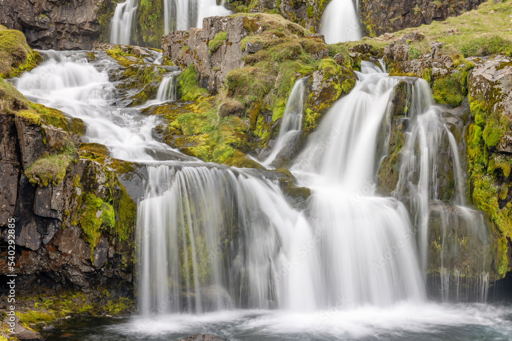 Obraz premium View at Kirkjufellsfoss cascade waterfall, popular tourist spot,Iceland