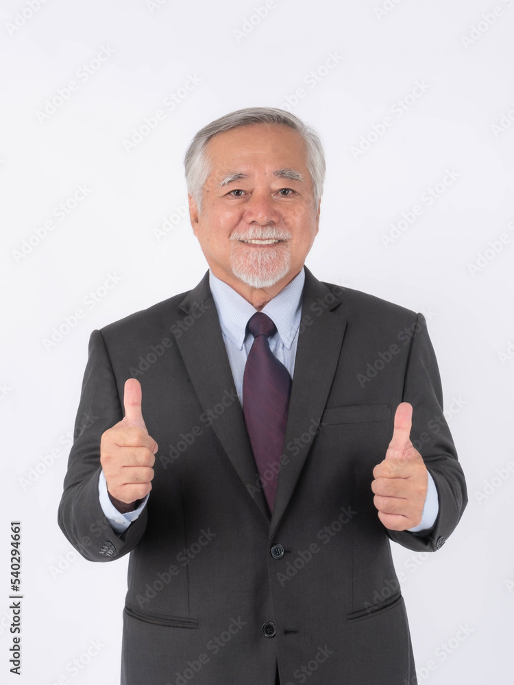 portrait of a businessman , Asian senior man , old man with suit giving a thumb up hand on white background with copy space - lifestyle senior male concept portrait of a businessman , Asian senior man , old man with suit giving a thumb up hand on white background with copy space - lifestyle senior male concept