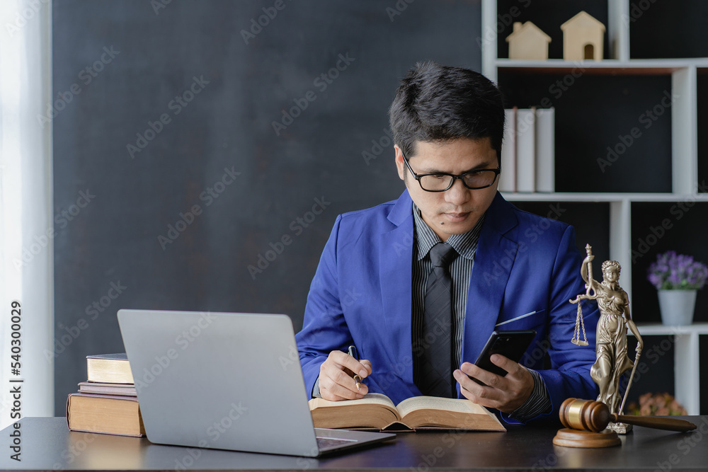 legal advisor concept Asian male lawyer working in office
Fairness Attorneys provide legal advice on the legality of business contracts.