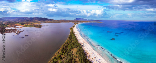 Italy. Sardegnia island nature scenery and best beaches. Aerial drone panoramic view of stunning La Cinta beach (San Teodoro) with turquoise sea and sault lake