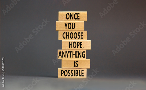 Hope and anything is possible symbol. Concept words Once you choose hope anything is possible on wooden blocks on a beautiful grey table grey background. Business and hope concept. Copy space