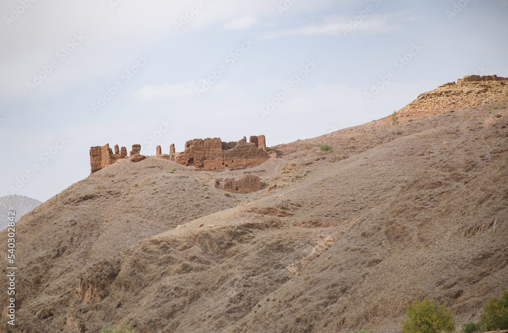 ancient village, castle on hills, in the Moroccan mountains, beautiful nature, large valleys, historical ruins, sublime architecture built by natural means, stone and sand. ancient village, castle on hills, in the Moroccan mountains, beautiful nature, large valleys, historical ruins, sublime architecture built by natural means, stone and sand.