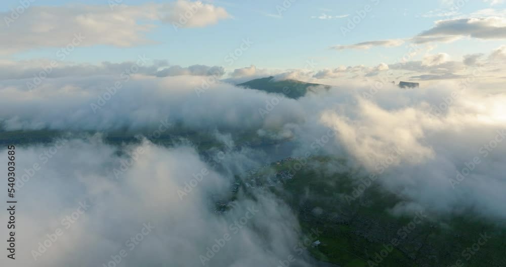 Aerial Forward Shot Of Houses On Landscape Seen From Clouds - Faroe Islands, Denmark Aerial Forward Shot Of Houses On Landscape Seen From Clouds - Faroe Islands, Denmark