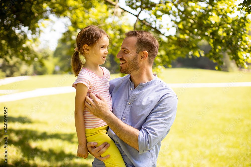 Fototapeta premium Father with daughter having fun at the park