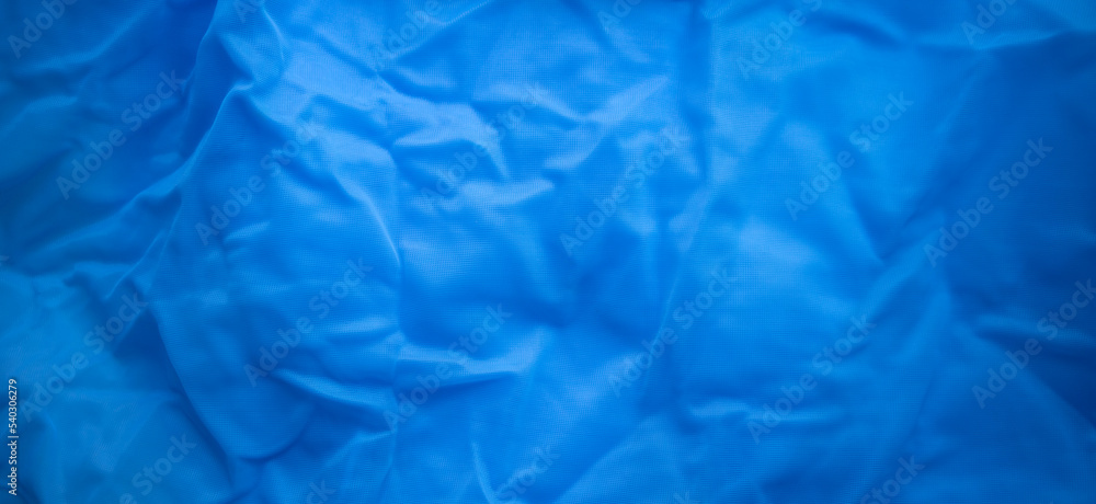 Rectangular texture of blue transparent fabric. Blue textile background. Sale of fabric for fashion designers. Rectangular texture of blue transparent fabric. Blue textile background. Sale of fabric for fashion designers.