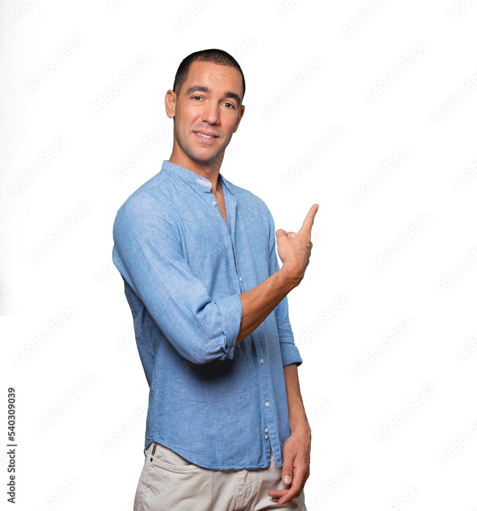 Amazed young man making a gesture of welcome Amazed young man making a gesture of welcome