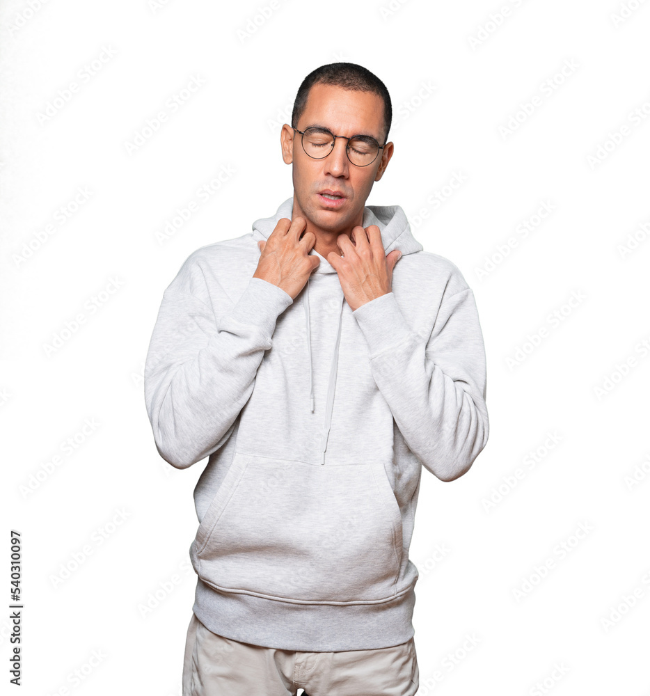 Depressed young man doing a gesture of stress Depressed young man doing a gesture of stress