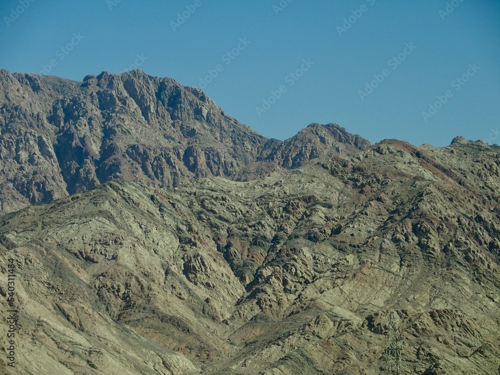 The mountains of Wadi Musa, Jordan, against the blue sky