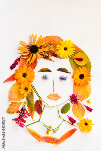 Fototapeta Naklejka Na Ścianę i Meble -  autumnal creative craft ideas from colorful autumnal leaves and flowers