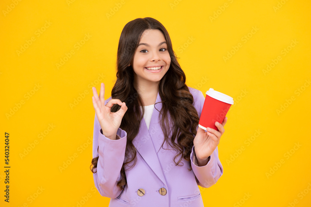 Teenage girl with take away cup of cappuccino coffee or tea. Child with takeaway cup on yellow background, morning drink beverage. Happy face, positive and smiling emotions of teenager girl. Teenage girl with take away cup of cappuccino coffee or tea. Child with takeaway cup on yellow background, morning drink beverage. Happy face, positive and smiling emotions of teenager girl.