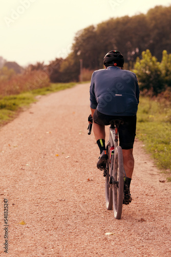 Man on bike in autumn afternoon