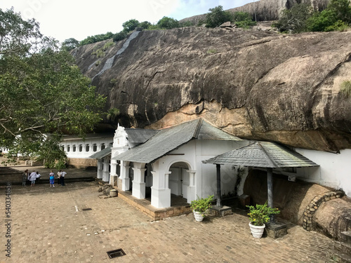 Dambulla, Sri Lanka, November 2019 - A house with a large rock