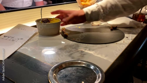 Waiter Clears Food And Plates From Restaurant Counter