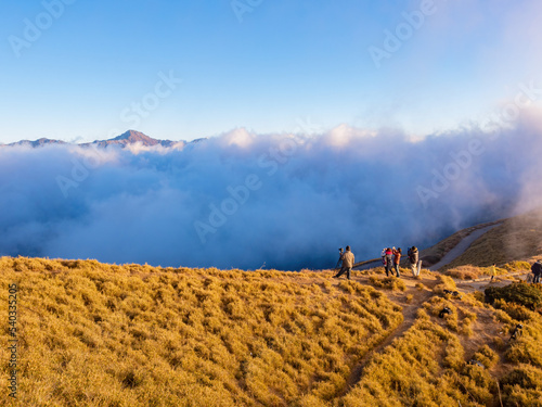 Photograher taking picture of the beautiful Sunset landscape of Sea of clouds over Hehuanshan photo