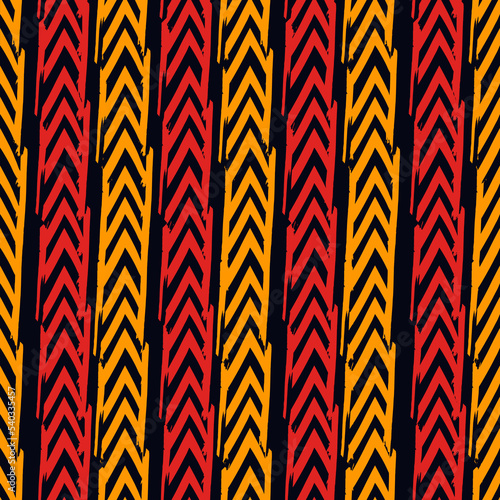 Seamless pattern. Paint brush chevrons and lines ornament. Hand drawn geometrical backdrop. Triangular shapes wallpaper. Geometric figures background. Ethnic motif. Textile print.