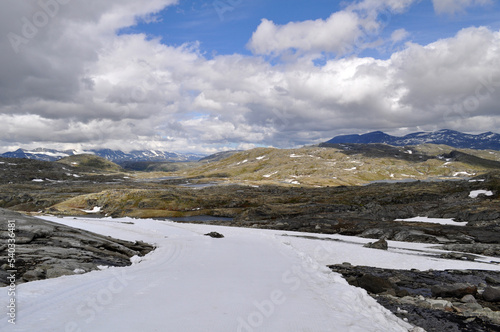 Sognefjell, Jotunheim, Norway - rocky landscape with snow in a natural park. Snow-covered rocks, mountains and icy lakes. © Jan