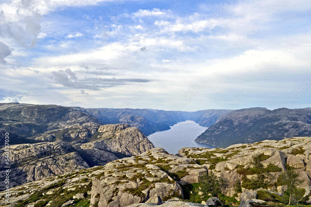 Rocky landscape with sea and deep fjord valley - Preikestolen, Norway