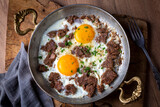 From traditional Turkish cuisine; fried eggs with meat. Turkish name; kavurmali yumurta