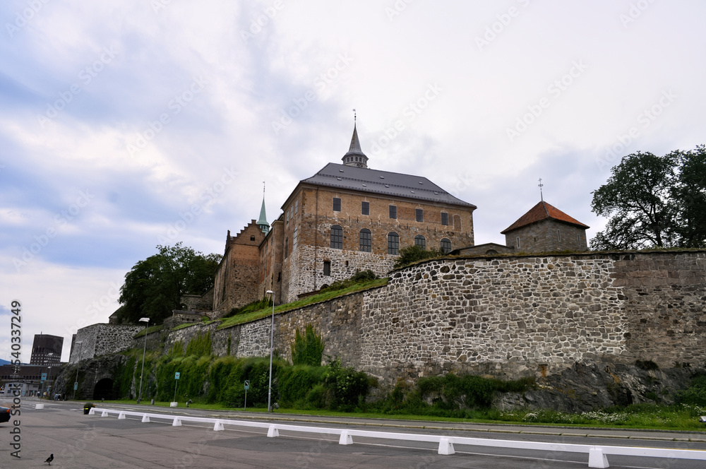 Oslo, Norway - Akershus Castle, an old fortress on the fjord embankment with a high stone wall.