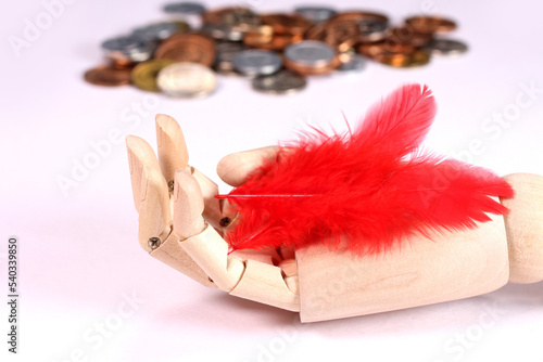 募金イメージ ウッドハンドと赤い羽根と硬貨