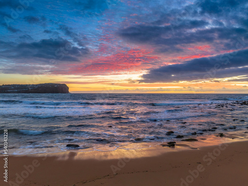 Sunrise seascape with clouds © Merrillie