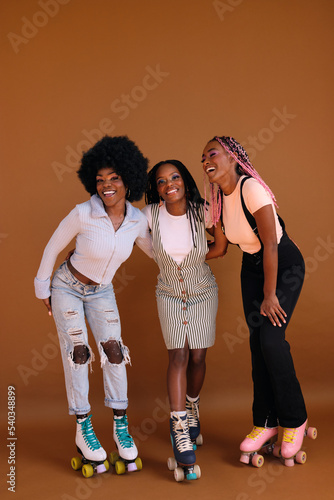 Studio portrait of young friend group on rollerskating
