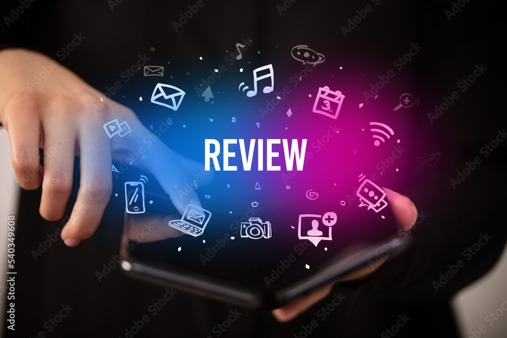 Businessman holding a foldable smartphone, social media concept Businessman holding a foldable smartphone, social media concept