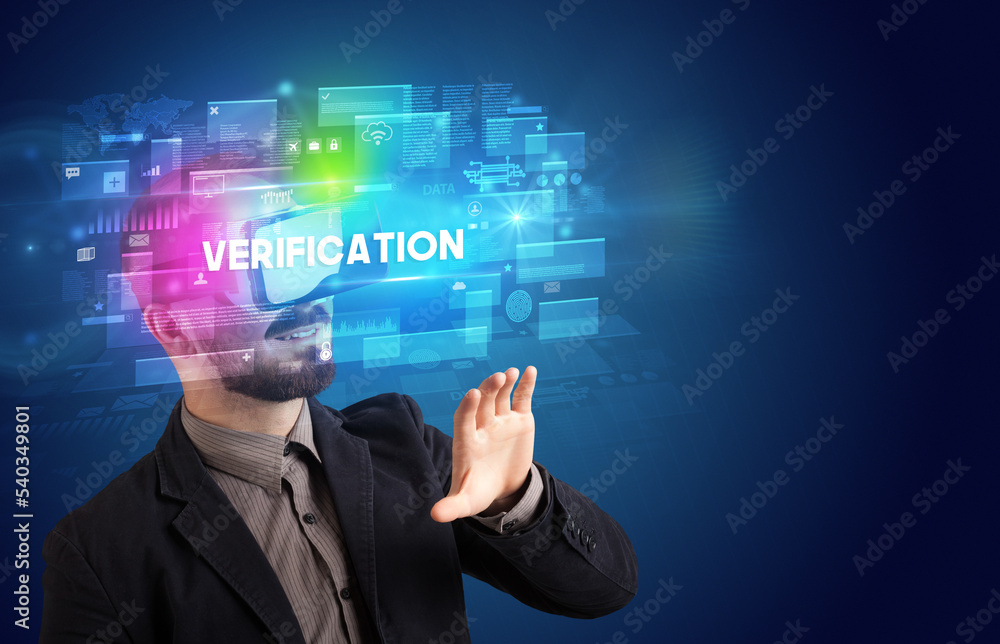 Businessman looking through Virtual Reality glasses