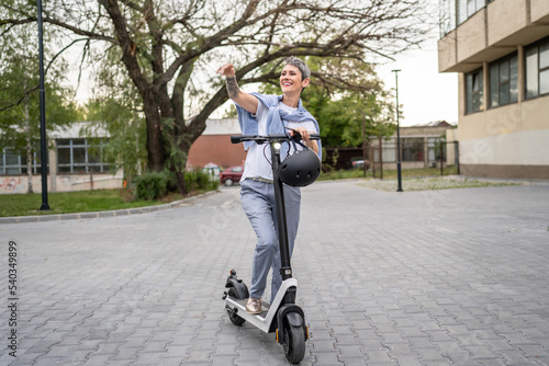 one woman mature senior caucasian stand by electric kick scooter