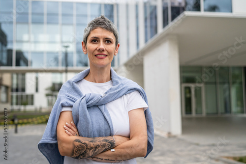 one woman portrait of mature senior caucasian female standing outdoor