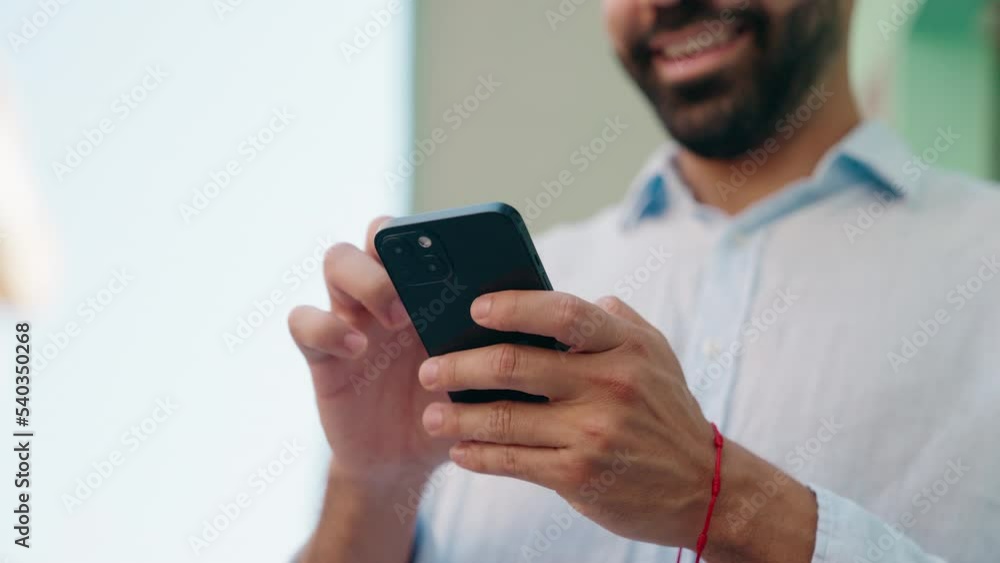 Young arab man smiling confident using smartphone at street Young arab man smiling confident using smartphone at street
