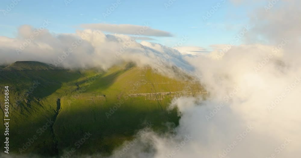 Aerial Forward Idyllic View Of Tranquil Green Mountains Under Cloudy Sky - Faroe Islands, Denmark Aerial Forward Idyllic View Of Tranquil Green Mountains Under Cloudy Sky - Faroe Islands, Denmark