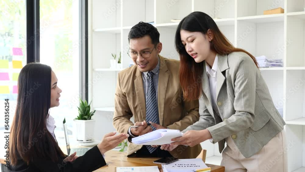 Asia business meeting consultations of business people in the company's meeting room. Asia business meeting consultations of business people in the company's meeting room.