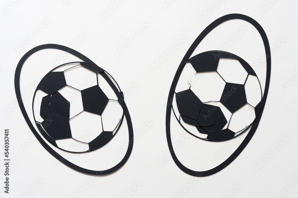 soccer ball glyph or dingbat cutout and arranged inside oval rings on white background soccer ball glyph or dingbat cutout and arranged inside oval rings on white background
